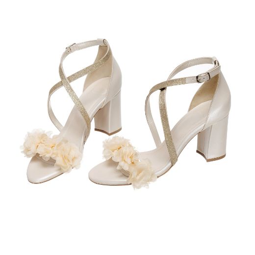 Handmade ivory bridal block heel sandals with champagne floral embellishments and glitter cross straps