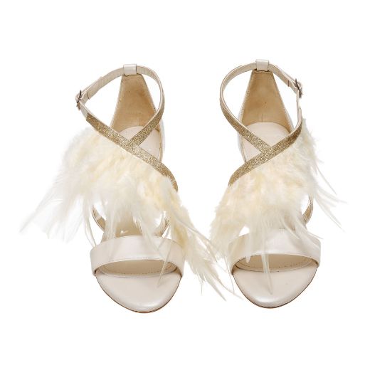 Handmade ivory bridal block heel sandals with glitter cross straps and feather details