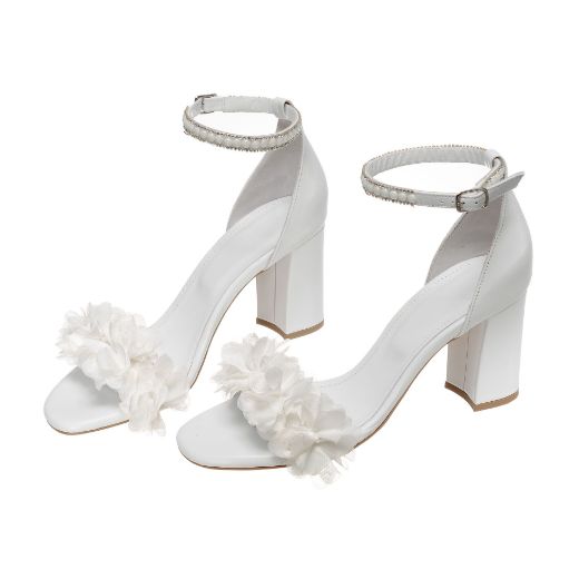 Handmade white bridal block heel sandals with pearl ankle strap and floral embellishments