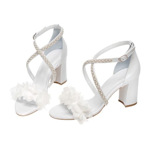 Handmade white bridal block heel sandals with pearl cross straps and floral details