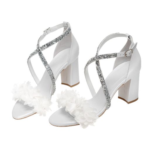 Handmade white bridal block heel sandals with glitter cross straps and floral details