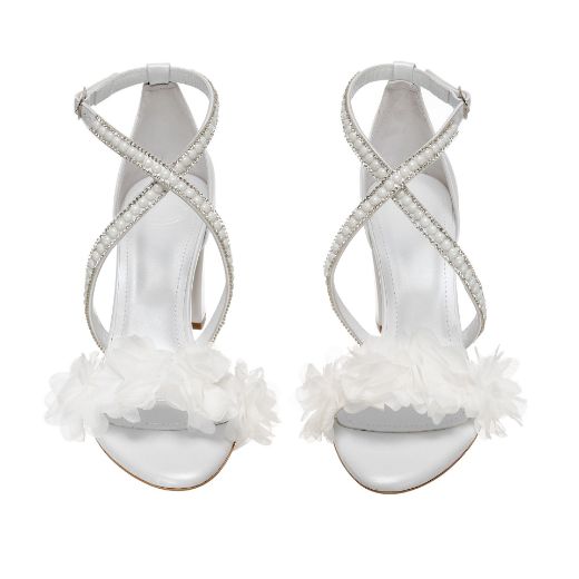 Handmade white bridal block heel sandals with rhinestone cross straps and floral details