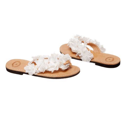 Handmade flat bridal sandals with white flowers along the straps