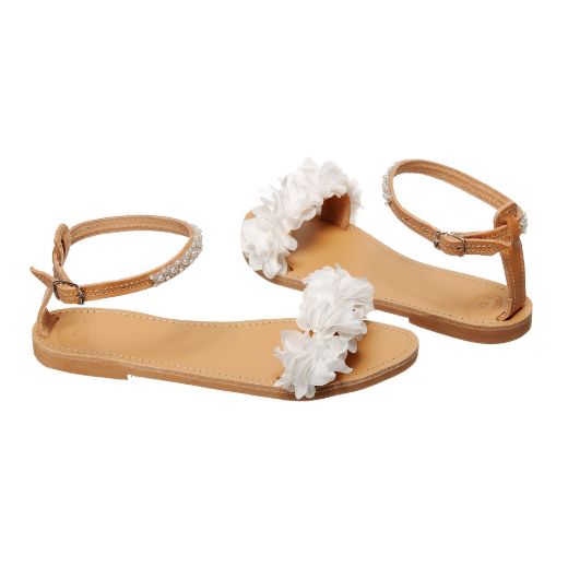 Handmade flat bridal sandals with white flowers around the ankle and lace front straps