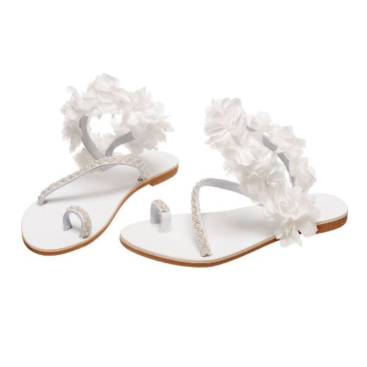 Handmade flat bridal sandals with white floral ankle embellishments