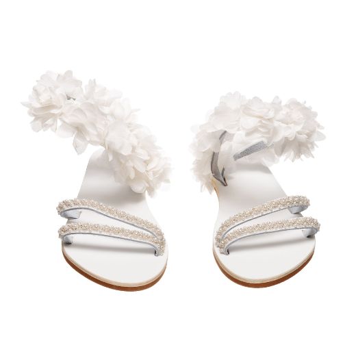 Handmade flat bridal sandals with white floral ankle detail and rhinestone straps