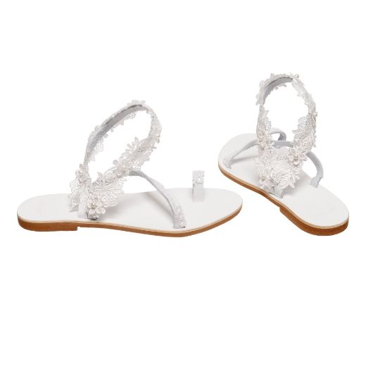 Handmade flat white bridal sandals with lace ankle details