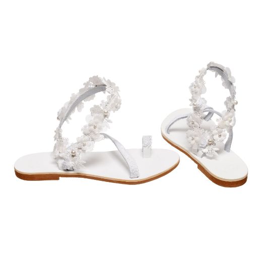 Handmade flat bridal sandals with lace straps and pearl floral ankle detail