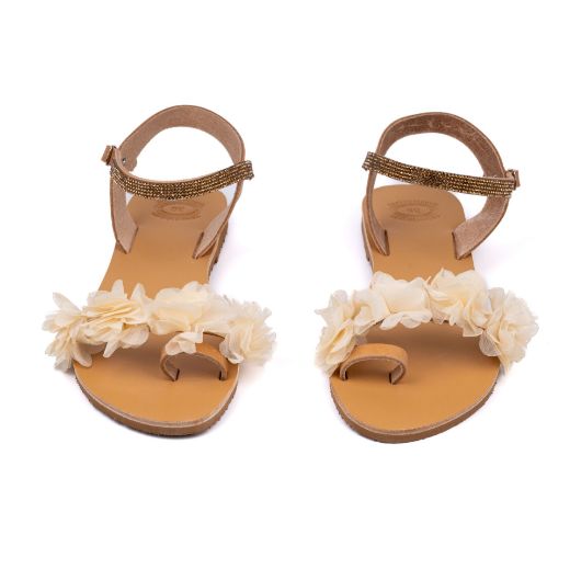 Handmade flat bridal sandals with three-dimensional ivory flowers and gold ankle detail