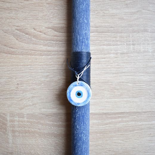 woman's lambatha candles with evil eye