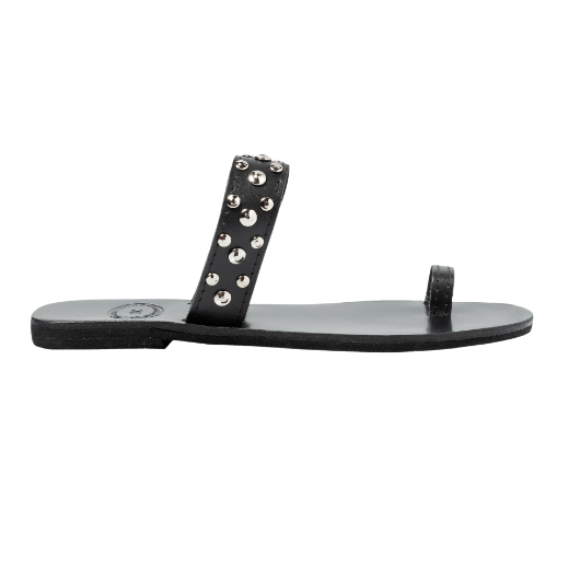 A black slip-on sandal with a single wide strap across the foot and a narrow toe strap, both decorated with metal studs.