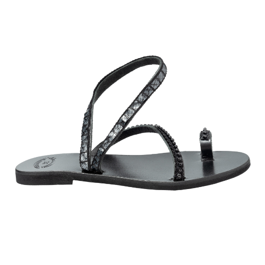 A black sandal with two crisscrossing upper straps and a toe loop, adorned with small beads or decorative elements.
