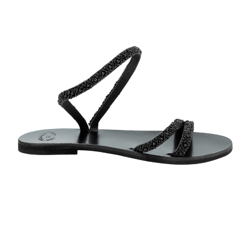 A black sandal with a single looped strap around the ankle and two thin upper straps, embellished with small decorative elements.