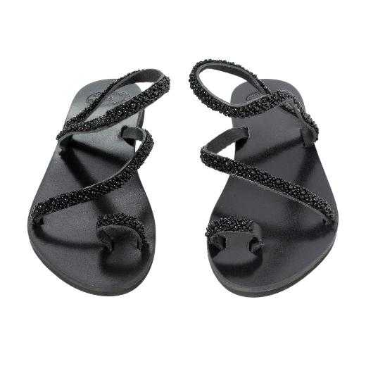 A black sandal with two upper straps, one plain and the other textured, and a loop for the toe.