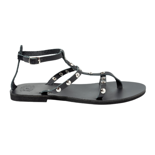 A black sandal featuring multiple thin straps, including one around the ankle and several on the upper foot, with metallic studs as embellishments.