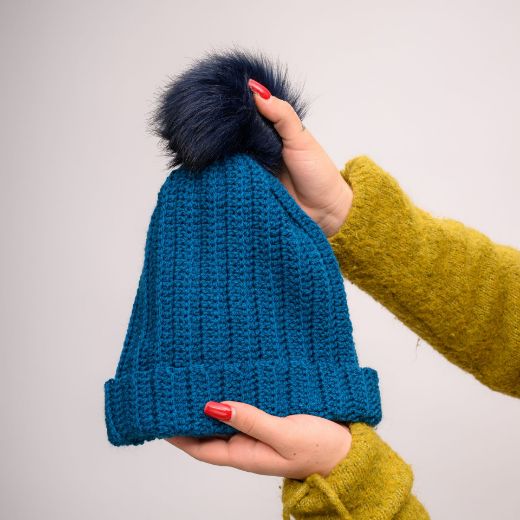 Picture of Handmade crochet beanie with faux fur pom in petrol blue
