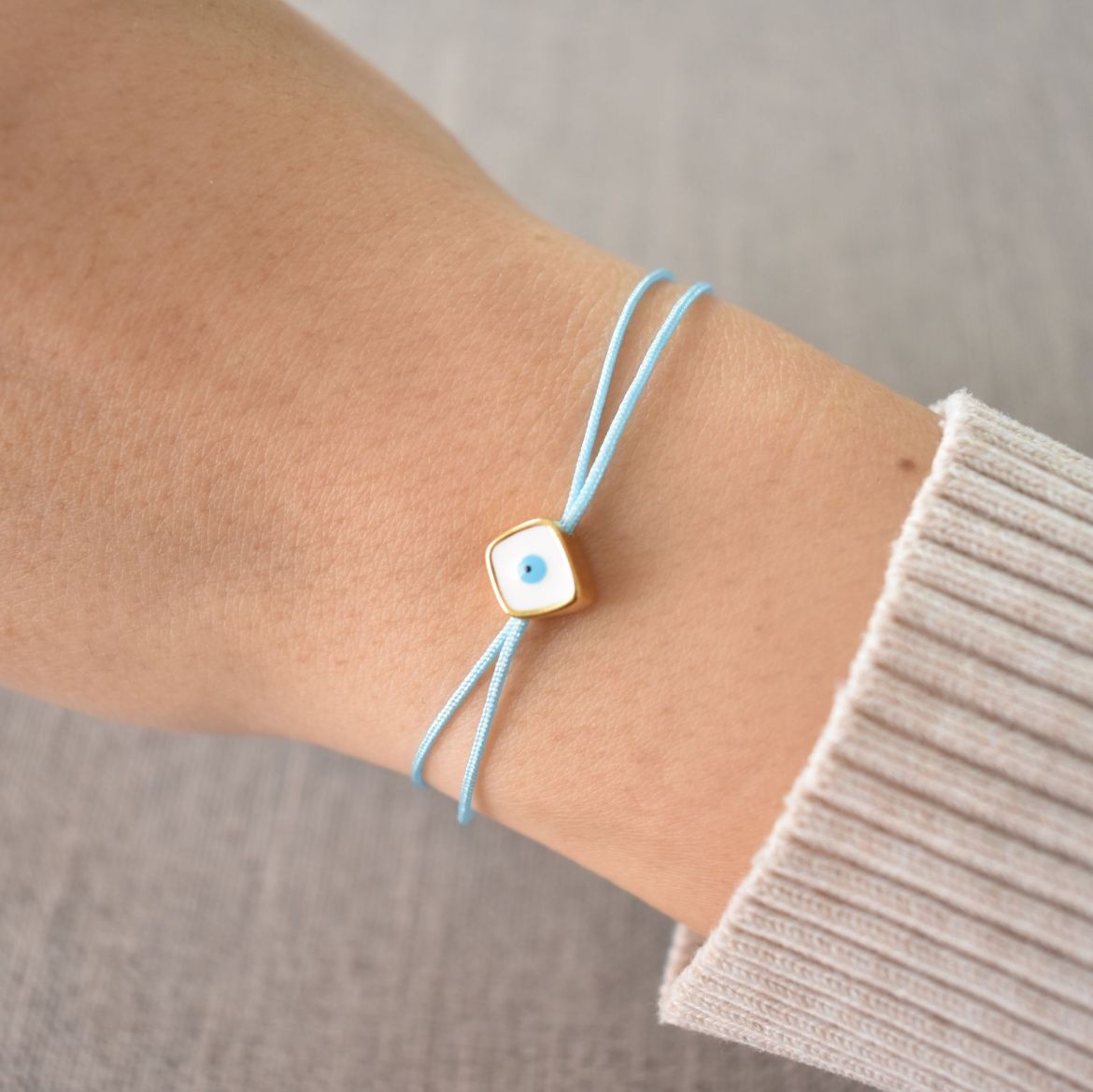 Picture of 24k gold plated white square evil eye bracelet