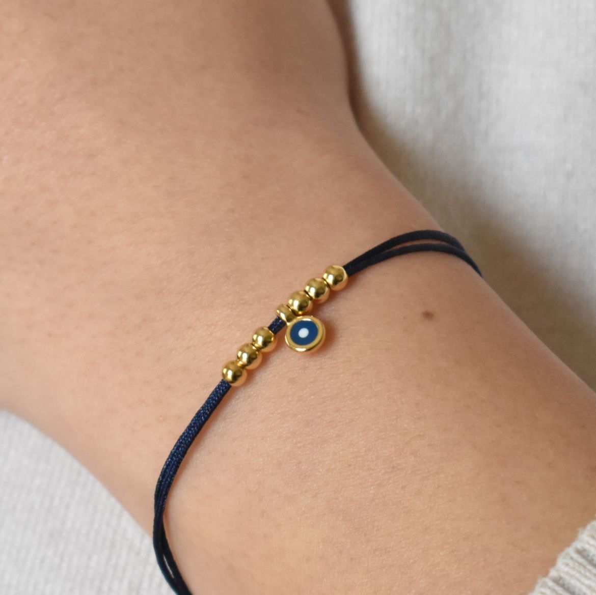 Picture of 24k gold plated small round evil eye bead bracelet