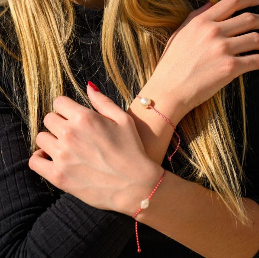 Spring bracelet with pearl detail – simple protection bracelet red cord