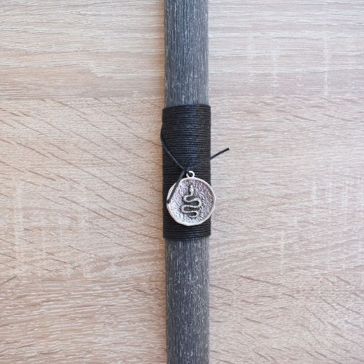 man’s orthodox easter candle with snake detail