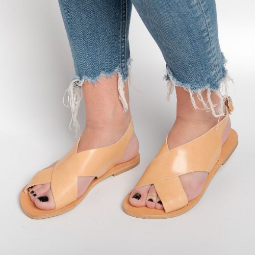 nude women's leather flat sandals with cross straps