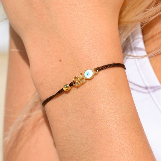 Εικόνα της Σετ βραχιόλι και λαστιχάκι μπεζ καρό